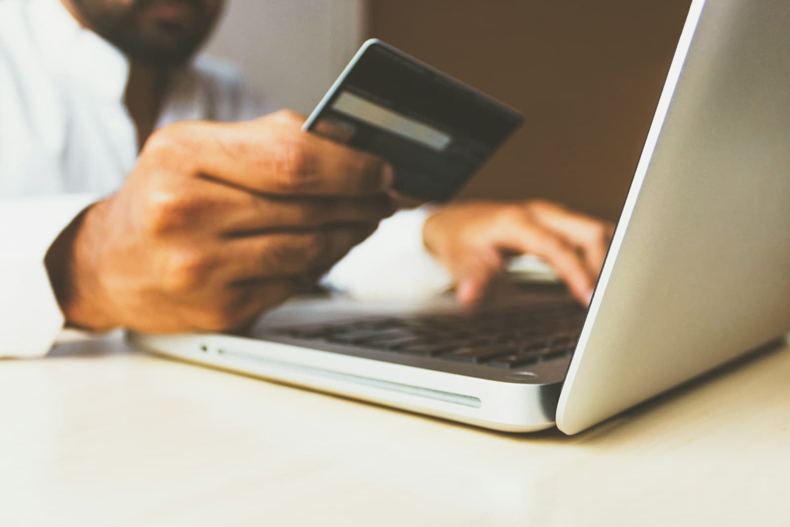 Online shopping with a card and laptop