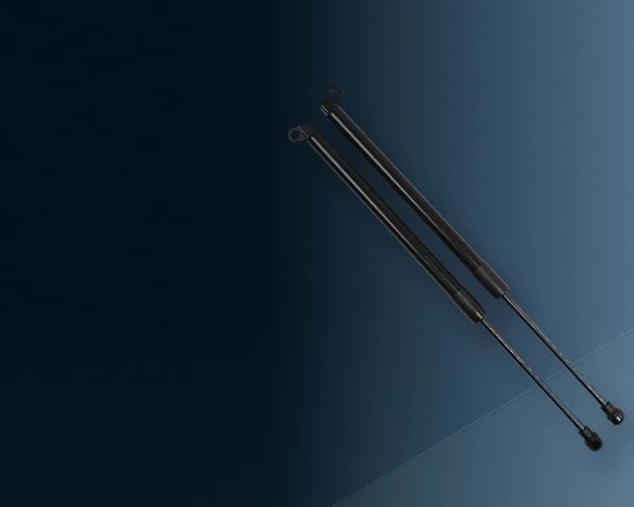 Pair of automotive lift supports on a clean steel-blue background for practical car care.